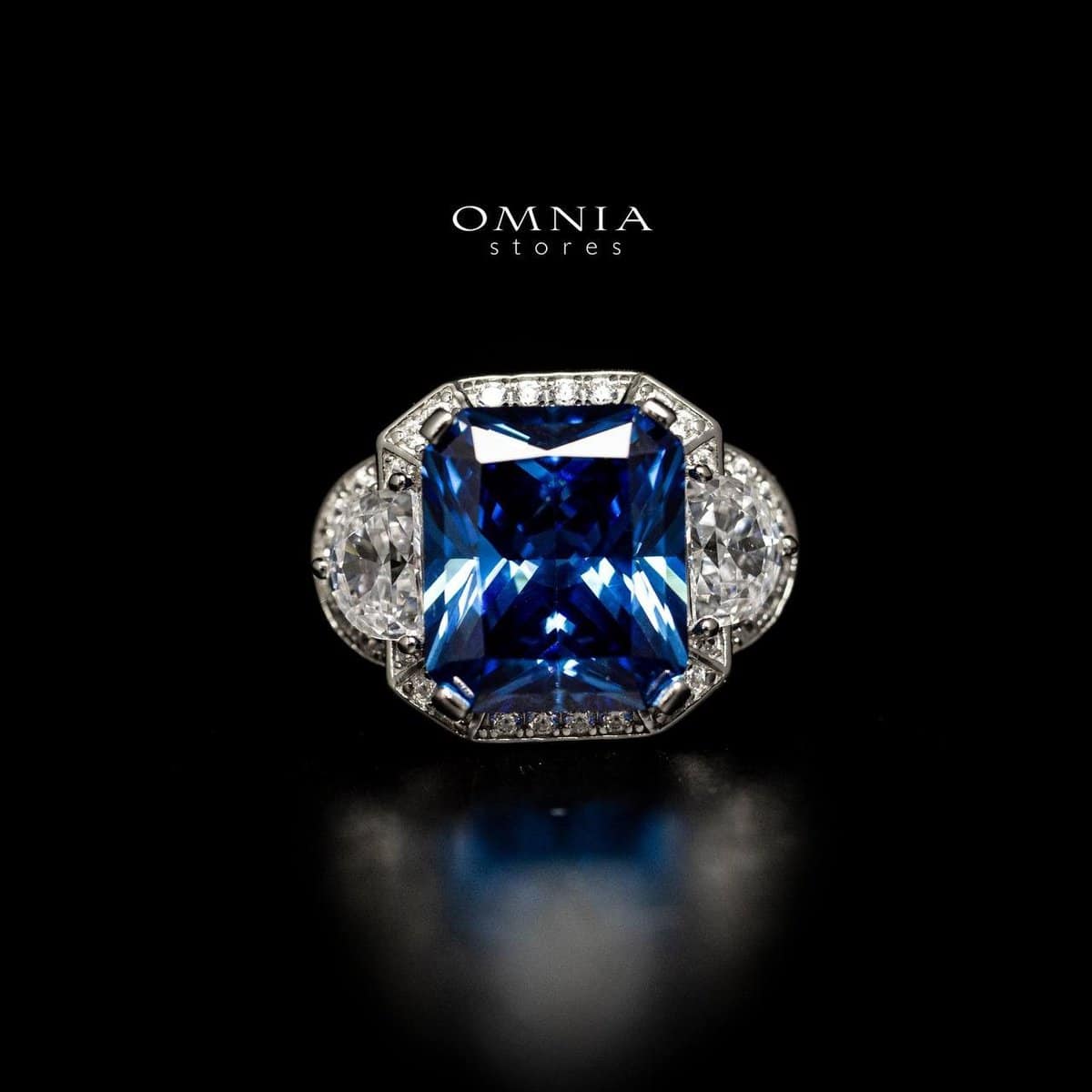 Omnia Sadeen Emerald Cut Sapphire Blue Ring in 92.5 Silver with High Quality Simulated Diamonds - OMNIASTORES UAE