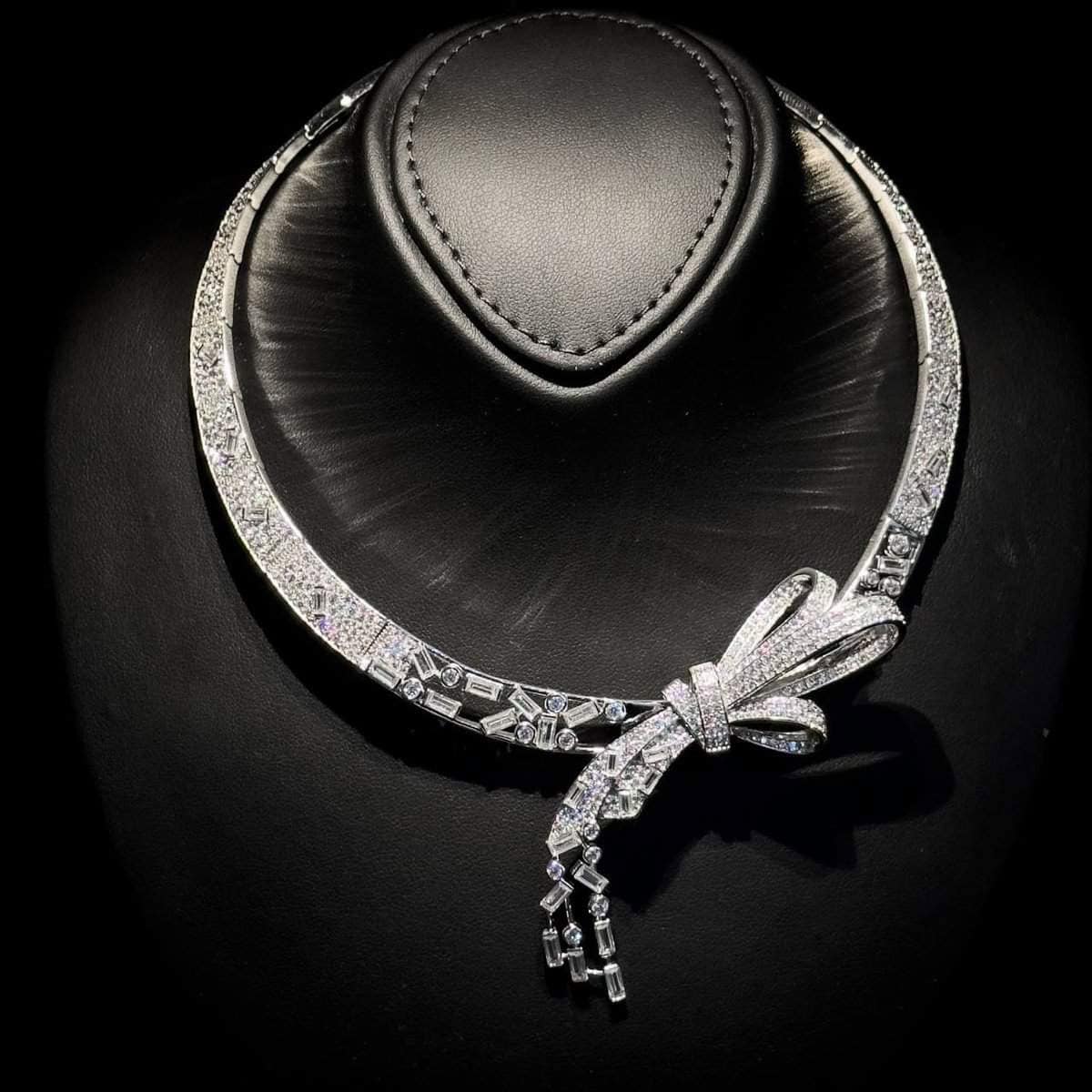 Omnia Celeste Bow Necklace in 925 Silver with High-Quality Simulated Diamonds and Elegant Geometric Detailing - OMNIASTORES UAE