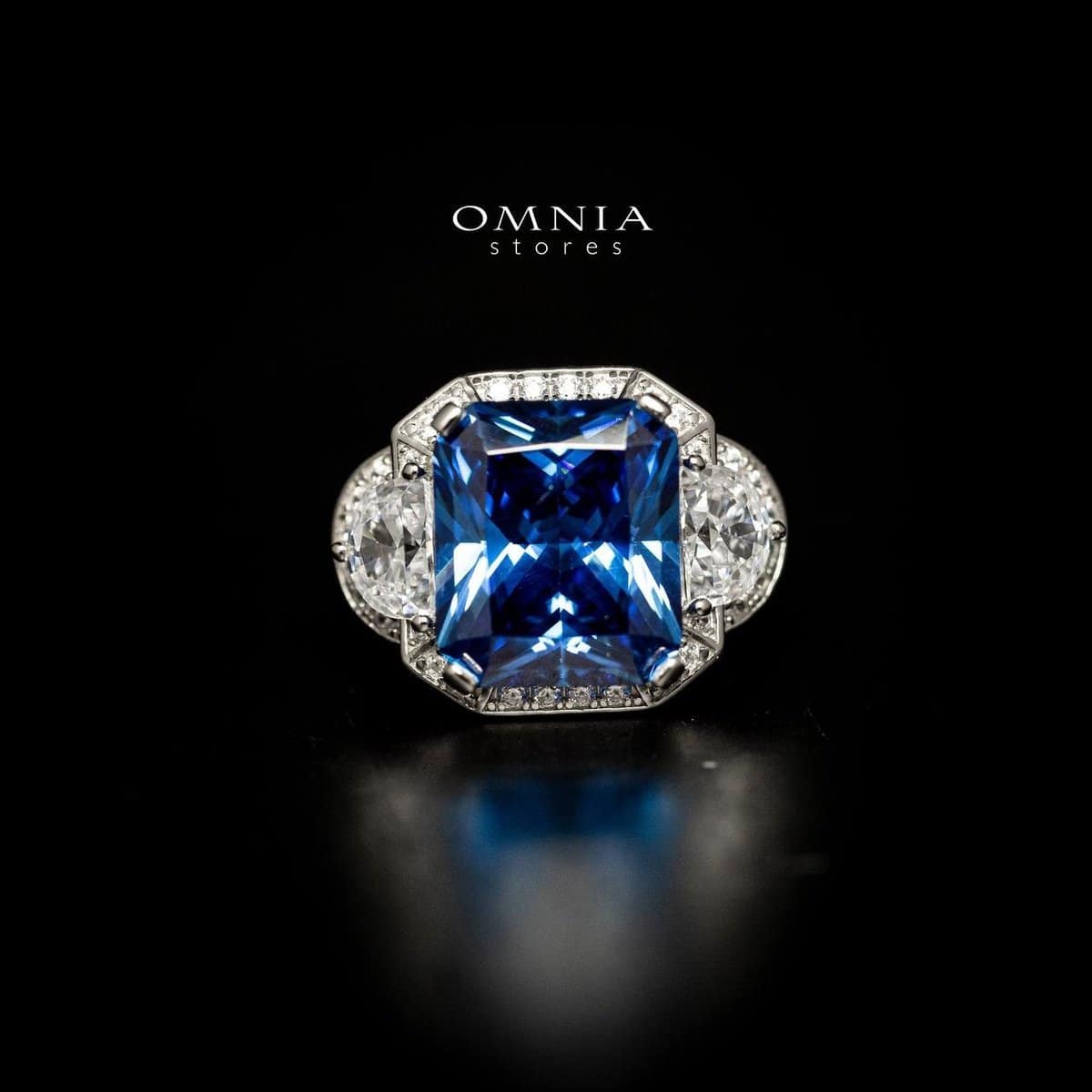 Omnia Sadeen Emerald Cut Sapphire Blue Ring in 92.5 Silver with High Quality Simulated Diamonds - OMNIASTORES UAE