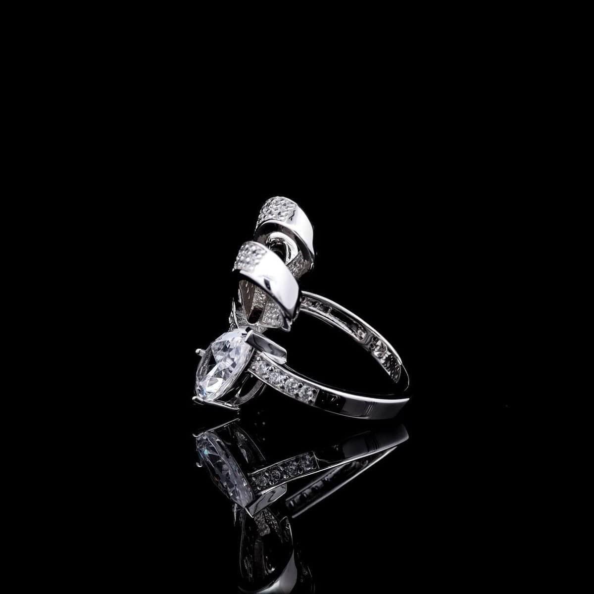 Omnia Celeste Bow Design Ring in 92.5 Silver with High-Quality Simulated Diamonds and a Pear-Shaped Accent - OMNIASTORES UAE