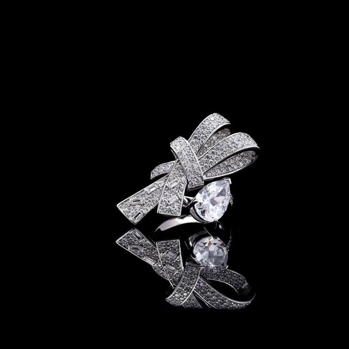 Omnia Celeste Bow Design Ring in 92.5 Silver with High-Quality Simulated Diamonds and a Pear-Shaped Accent - OMNIASTORES UAE