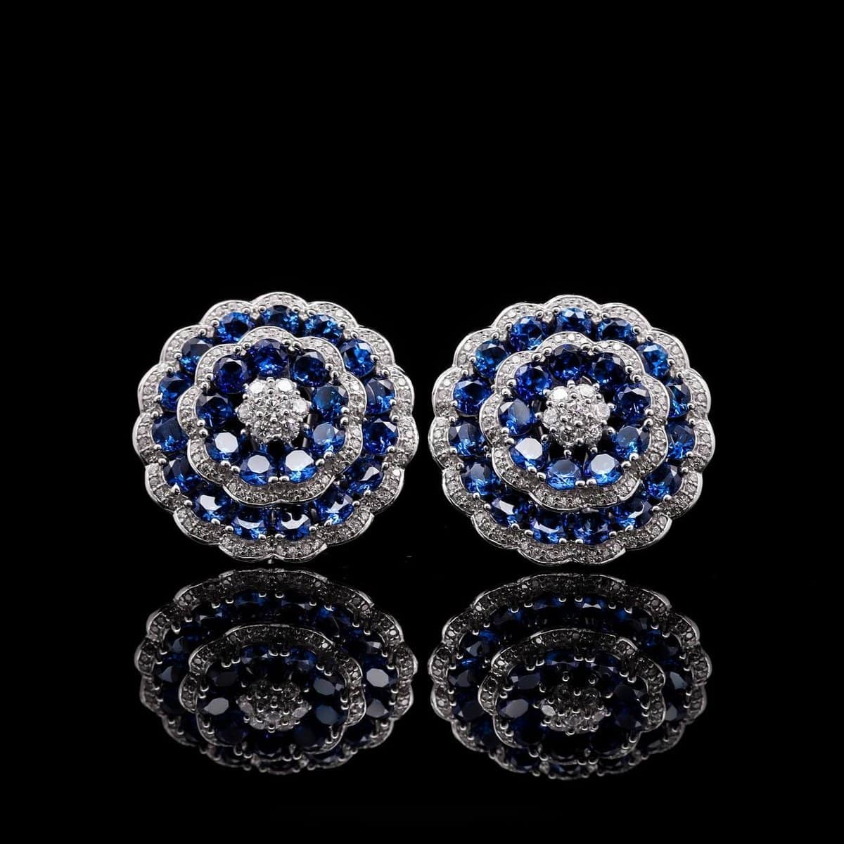 Omnia Floral Halo Earrings with Sapphire Blue Simulated Diamonds in 92.5 Silver - OMNIASTORES UAE