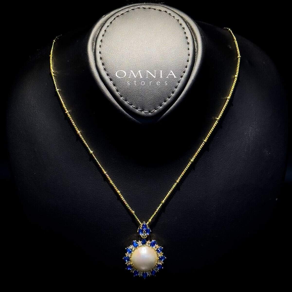 Omnia Celeste White Mabel Pearl Halo Pendant Necklace with Blue Sapphire Accents in Brass with Gold Plated Finish - OMNIASTORES UAE