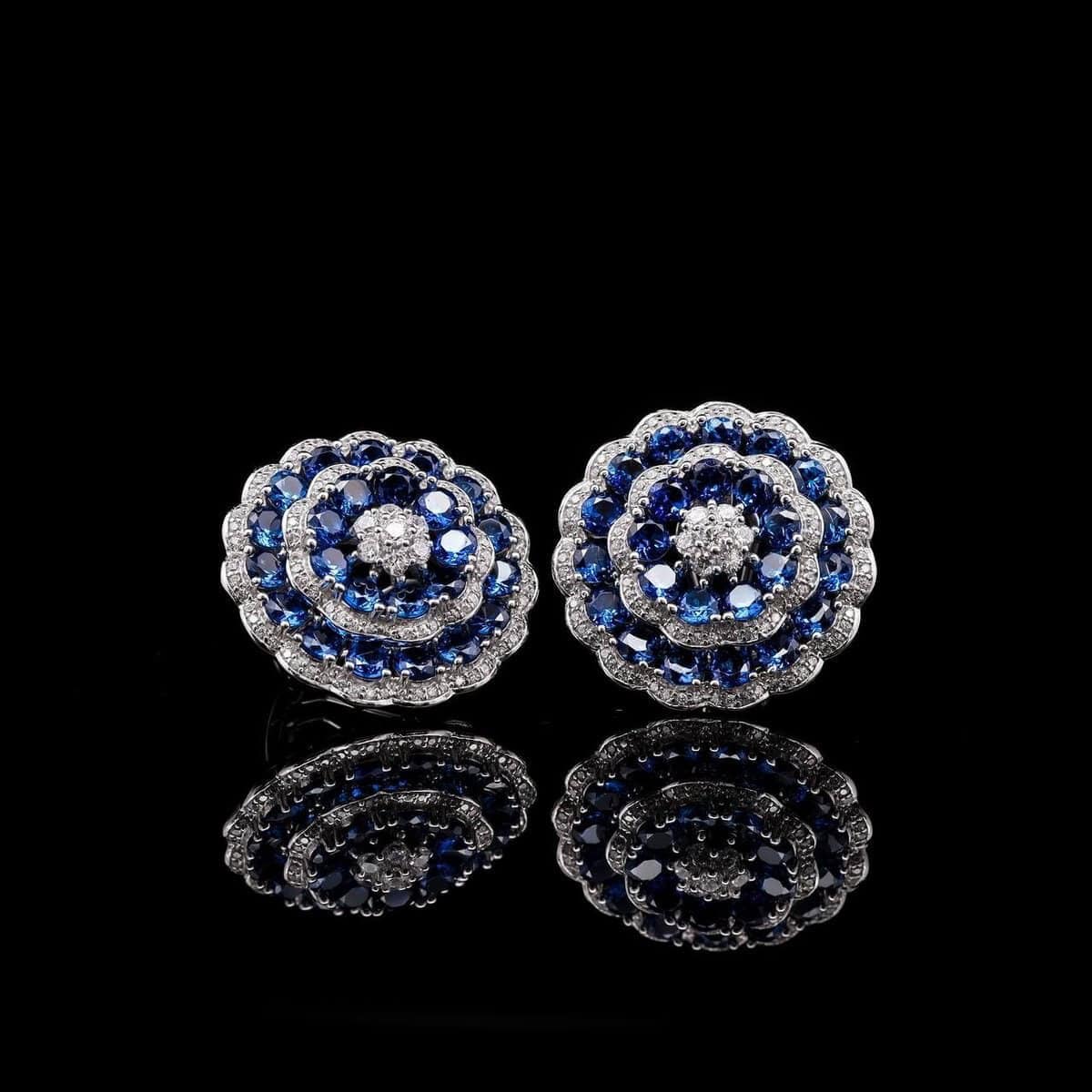 Omnia Floral Halo Earrings with Sapphire Blue Simulated Diamonds in 92.5 Silver - OMNIASTORES UAE