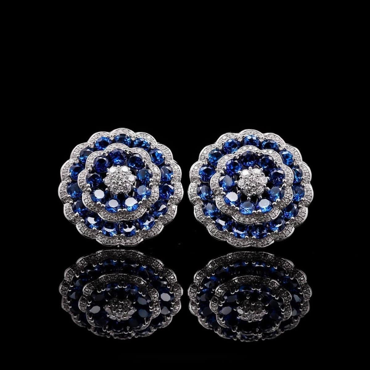 Omnia Floral Halo Earrings with Sapphire Blue Simulated Diamonds in 92.5 Silver - OMNIASTORES UAE