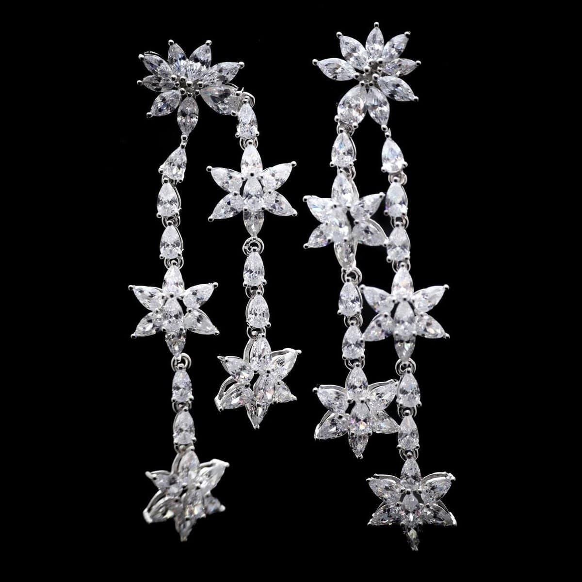 Omnia Starburst White Drop Earrings in 92.5 Silver with High-Quality Simulated Diamonds - OMNIASTORES UAE
