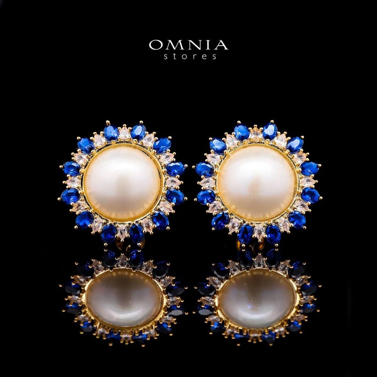Omnia Celeste White Mabel Pearl Halo Stud Earrings with Blue Sapphire Accents in Brass with Gold Plated Finish - OMNIASTORES UAE