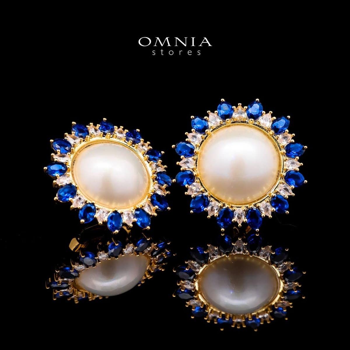 Omnia Celeste White Mabel Pearl Halo Stud Earrings with Blue Sapphire Accents in Brass with Gold Plated Finish - OMNIASTORES UAE