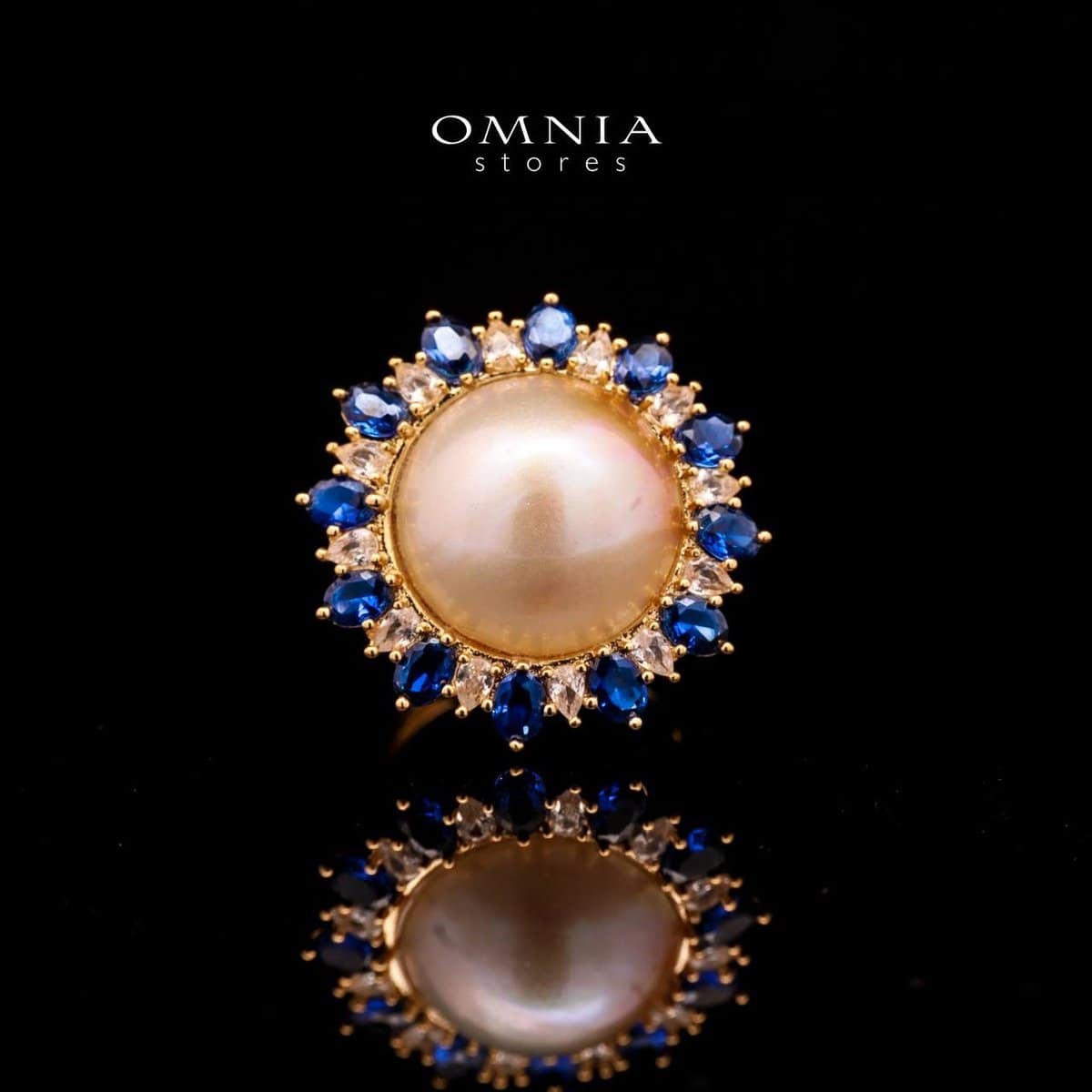 Omnia Celeste White Mabel Pearl Halo Ring with Blue Sapphire Accents in Brass with Gold Plated Finish - OMNIASTORES UAE