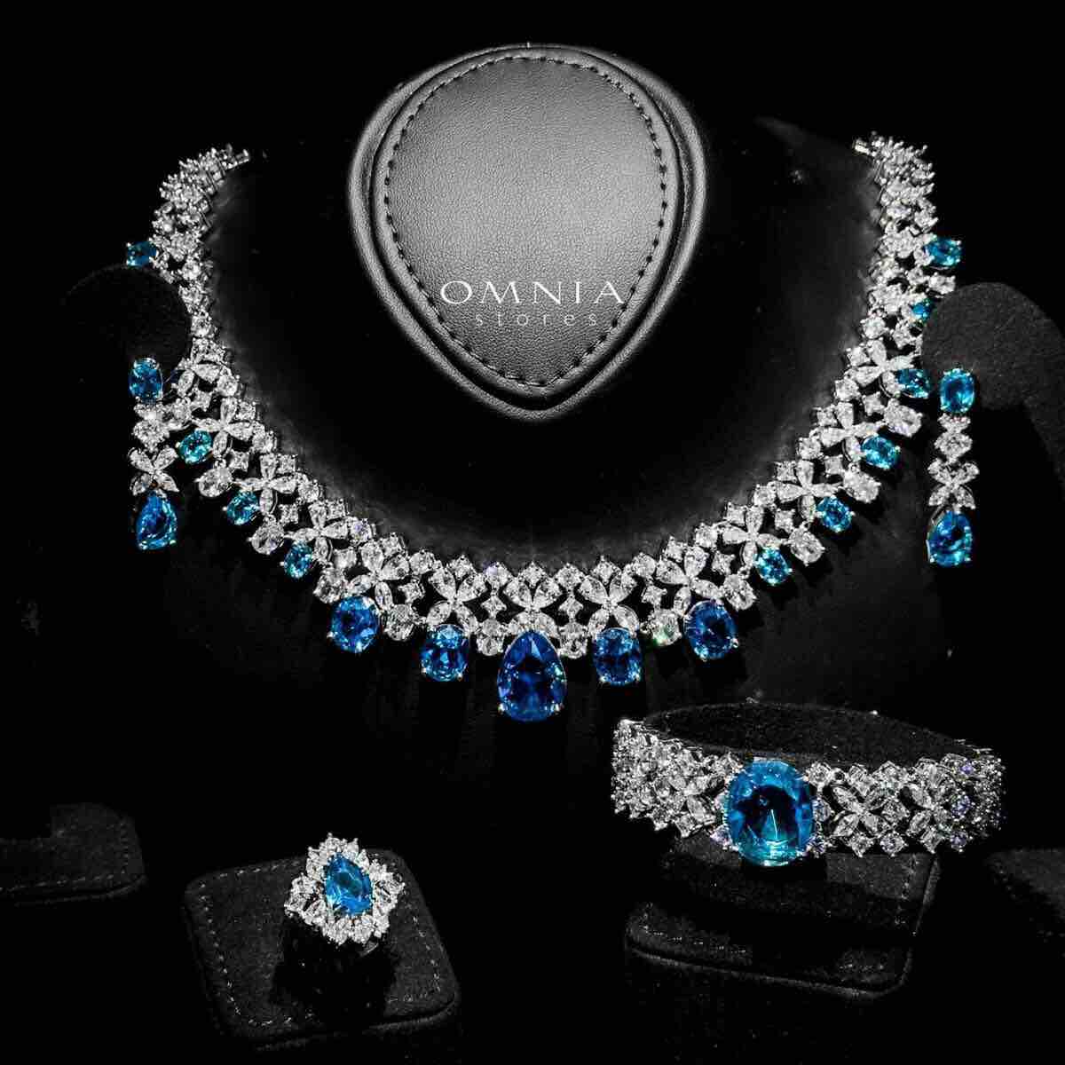 Omnia Suhana Sky Blue Bridal Full Set Designed with Pear-Cut and Round Simulated Diamonds in High-Quality Rhodium Plated Finish