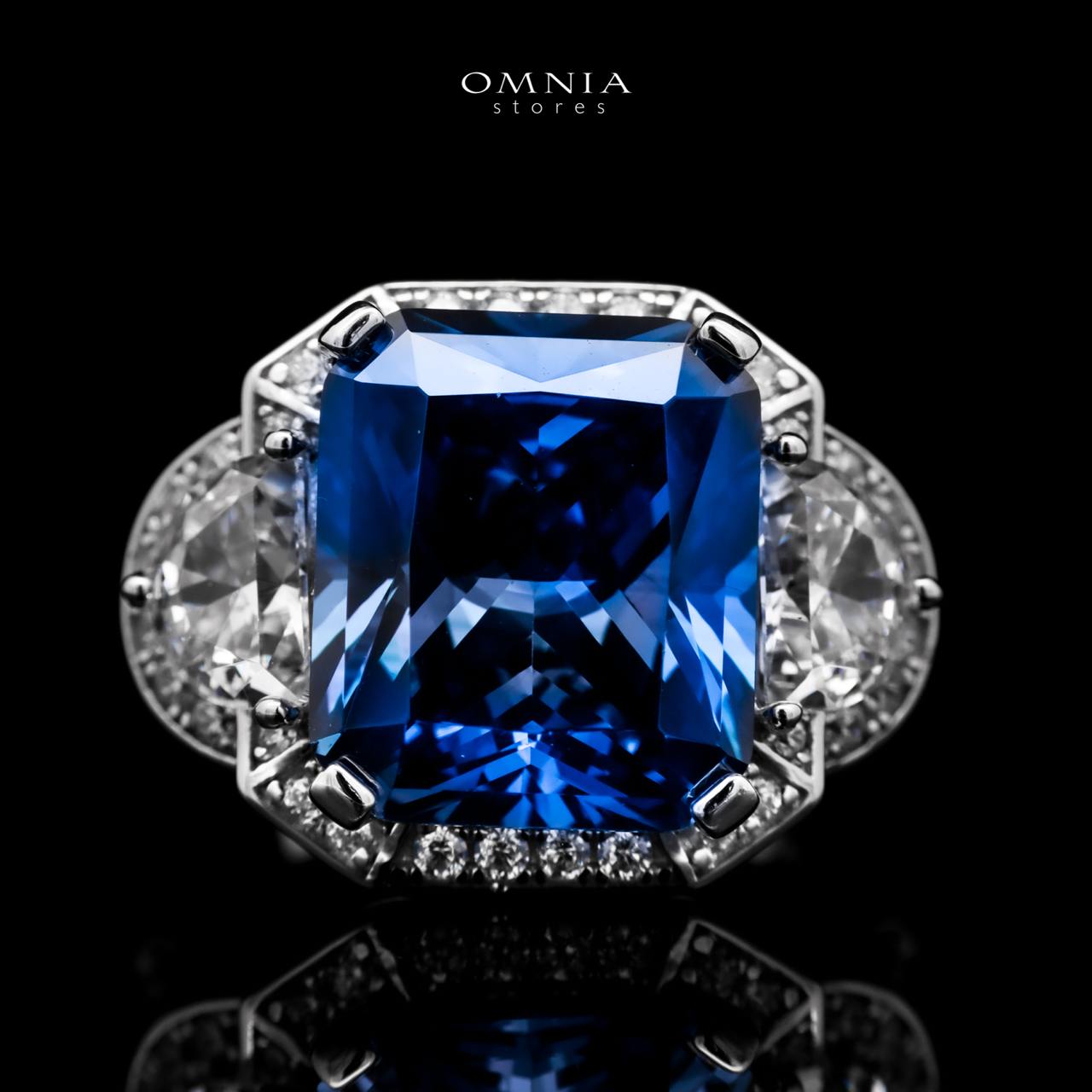 Omnia Sadeen Emerald Cut Sapphire Blue Ring in 92.5 Silver with High Quality Simulated Diamonds - OMNIASTORES UAE